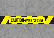 Caution watch your step floor tape - message on warehouse concrete