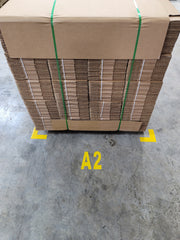 Floor Marking letter and number in front of yellow floor angle in warehouse