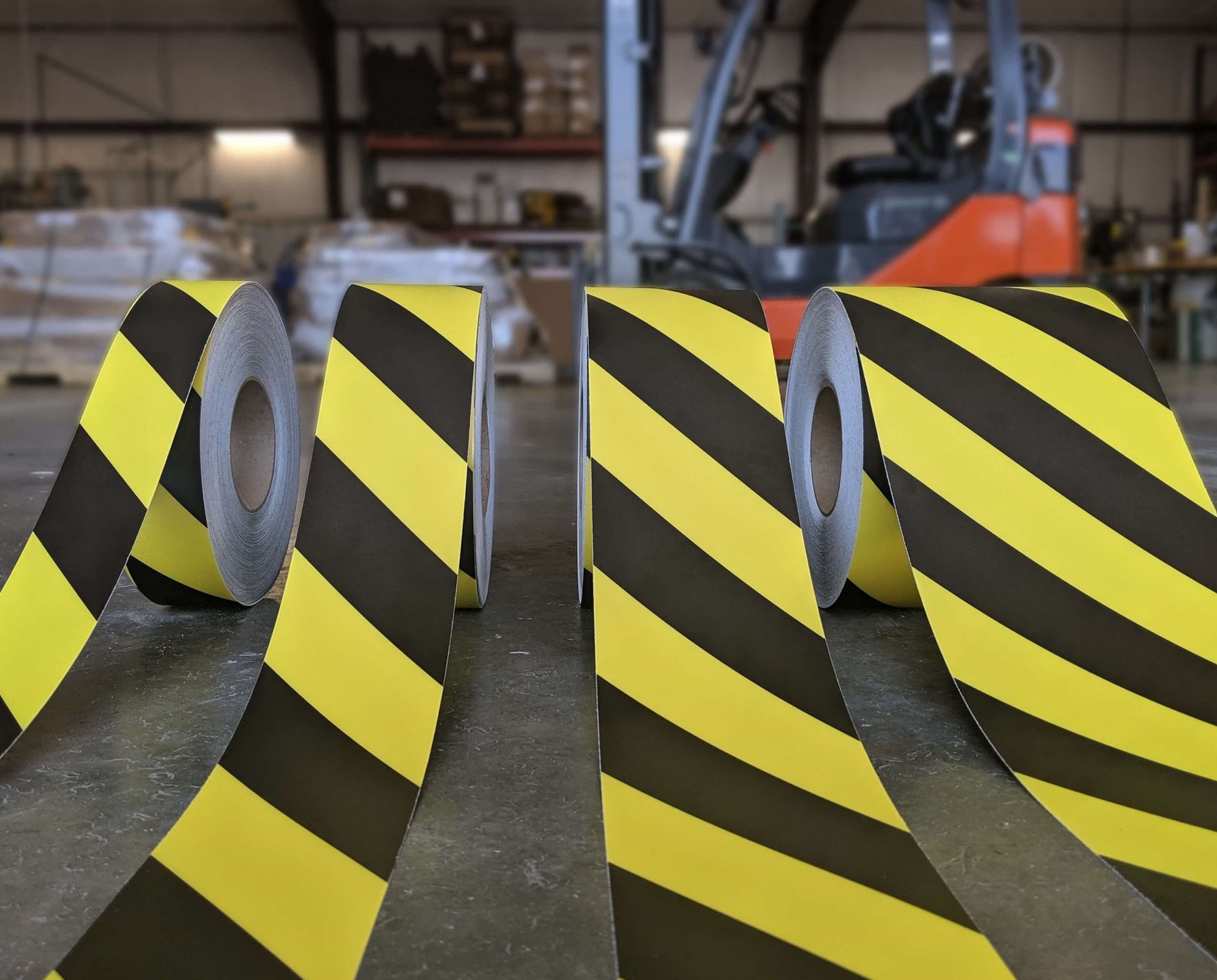 Floor Marking Tape in warehouse with forklift in background