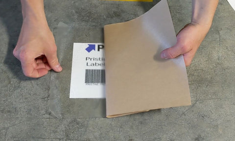 Cut label protective film over barcode on warehouse floor