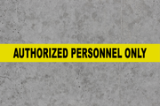 Authorized Personnel Only message tape on concrete floor