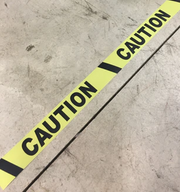 Caution Floor Tape on a warehouse floor