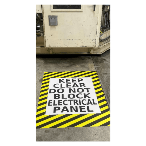 Electrical Panel Floor Sign in front of machine with message to Keep Clear