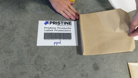 Installed peel and stick label protective film over barcode