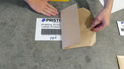 barcode peel and stick label protector. Clear film over label on floor