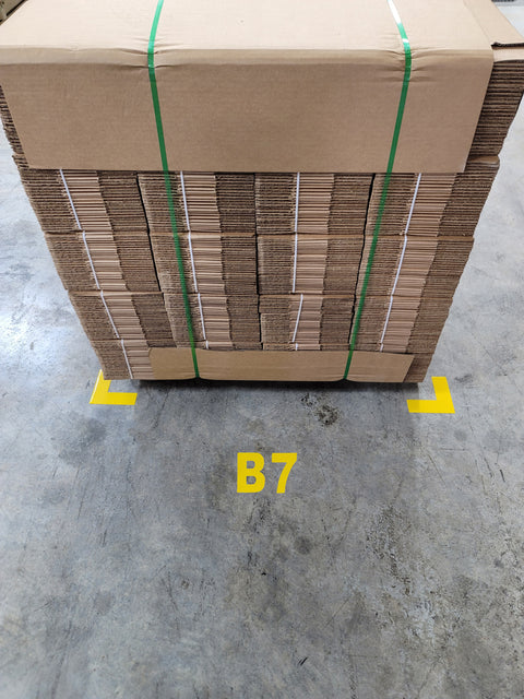 Warehouse floor number and letter in front of pallet and yellow floor corners