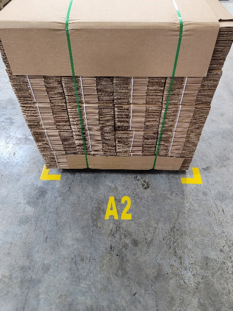 Yellow marking number on warehouse floor with pallet and yellow angles