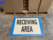 Floor Sign with receiving area message on warehouse floor locating skids for facility 5S