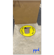 Adhesive Trash Can Floor Sign on Warehouse Floor