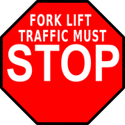 Red octagon stop floor sign with Forklift Traffic Must Stop message